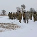 Cold-Weather Operations Course class 22-02 students learn about Arctic tent on snowy training day