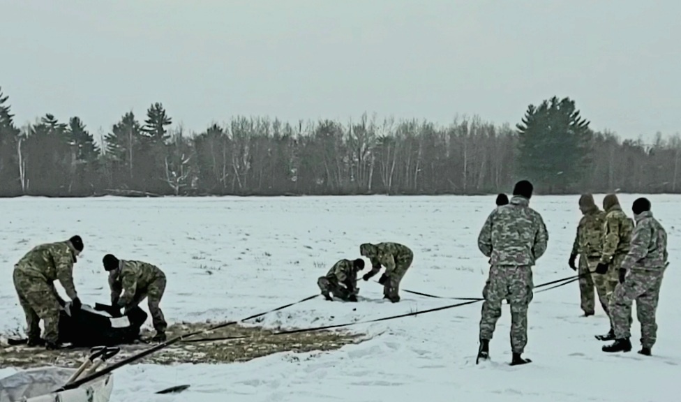 Cold-Weather Operations Course class 22-02 students learn about Arctic tent on snowy training day