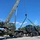 US Navy Seabees with NMCB-5 load a grader for equipment disposition onboard Camp Shields