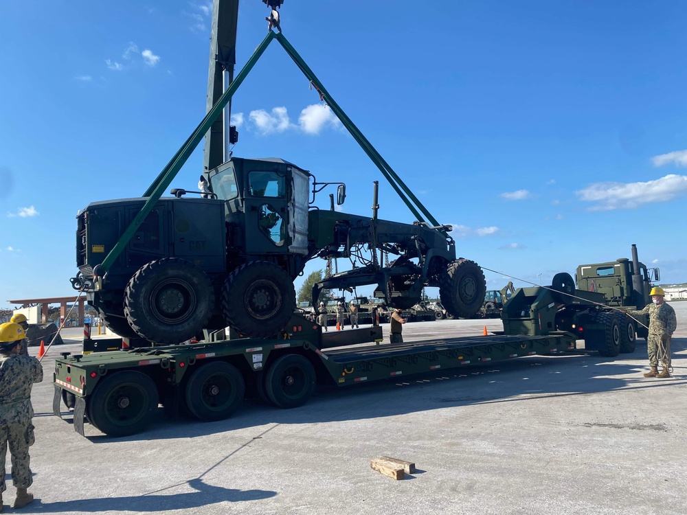 US Navy Seabees with NMCB-5 load a grader for equipment disposition onboard Camp Shields