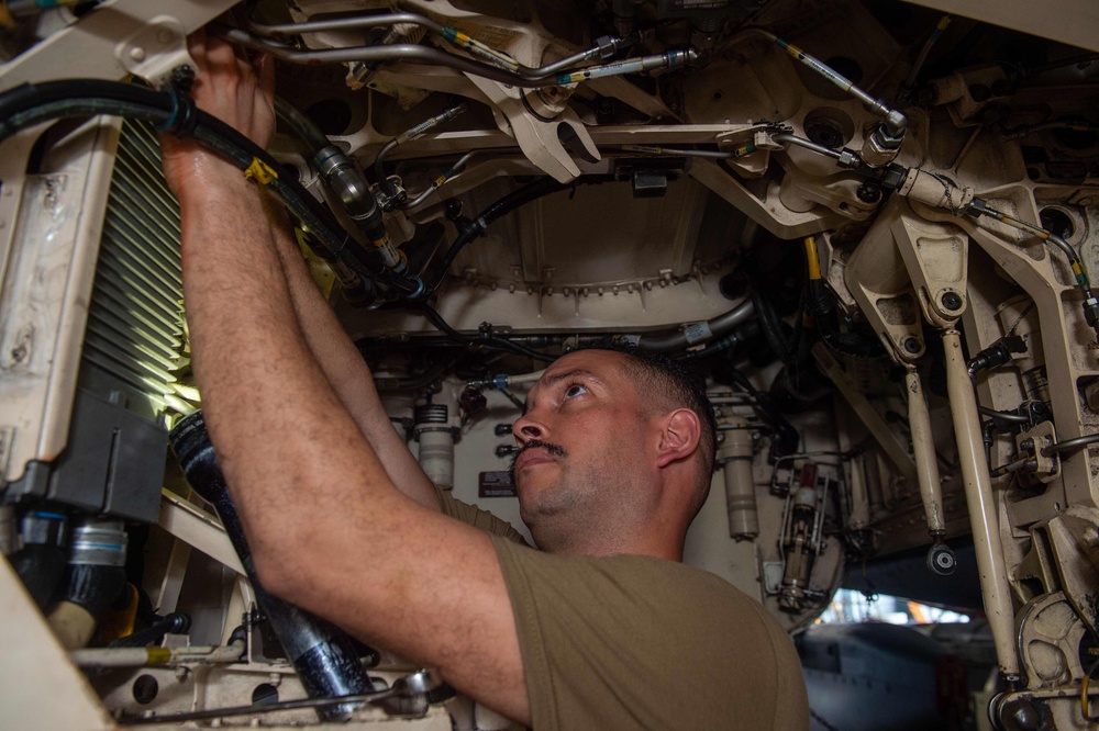 USS Carl Vinson (CVN 70) sailors conduct maintenance on an F/A-18F Super Hornet