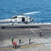 Helicopter takes off from the USS Carl Vinson (CVN 70) flight deck