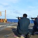 Sailors aboard USS Lake Champlain undergo small arms qualifications