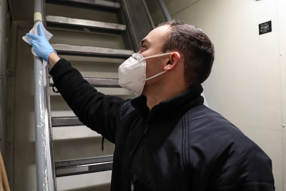 USS Ross Sailors keep the ship clean