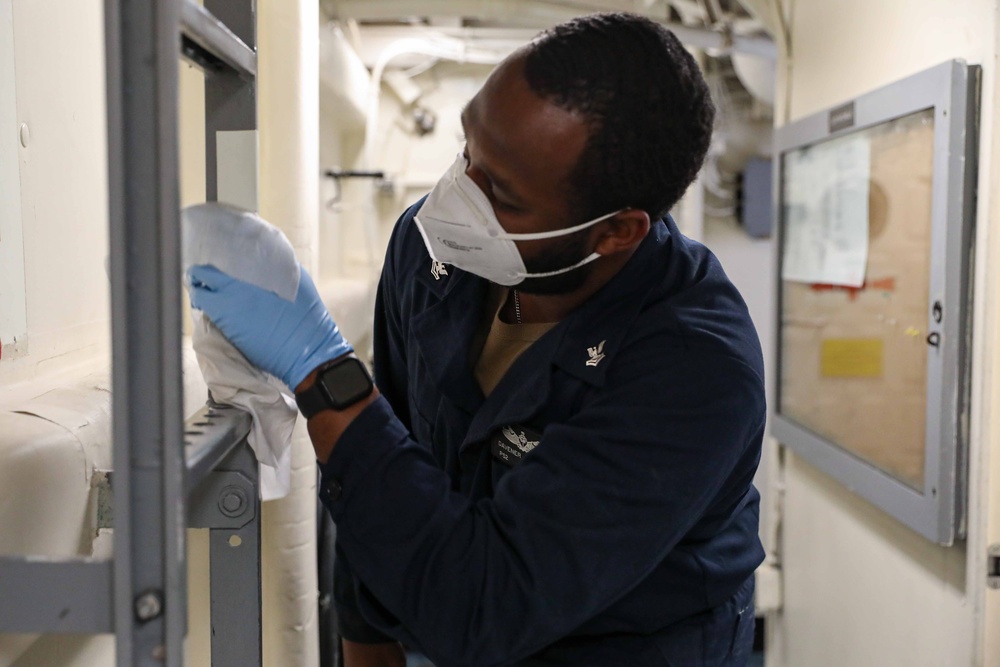 USS Ross Sailors keep the ship clean