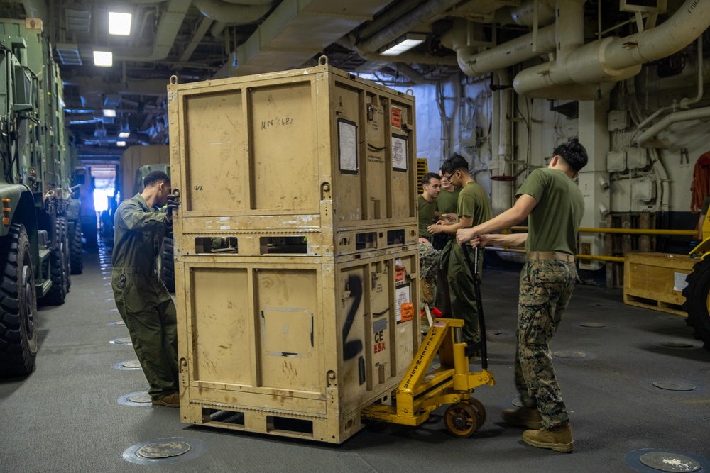 11th MEU Marines conduct forklift operations aboard USS Essex (LHD 2)