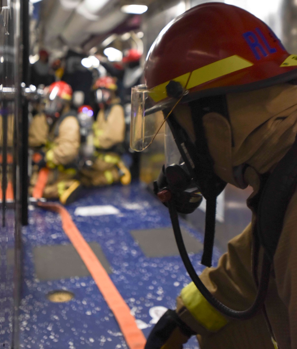 Abraham Lincoln Sailor participates in general quarters drill.