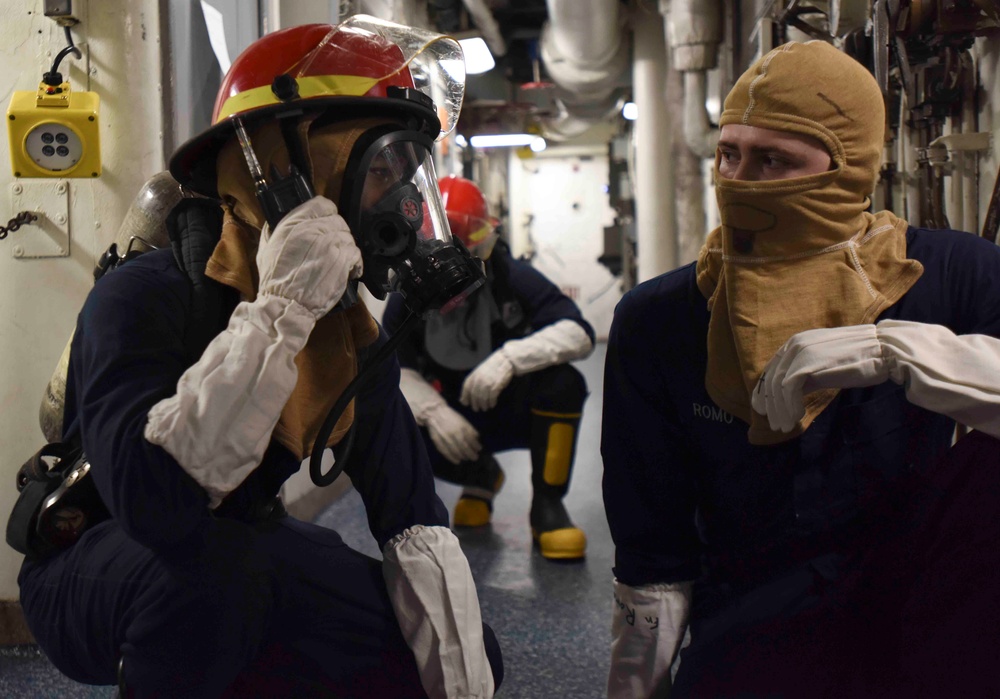 Abraham Lincoln Sailors participate in general quarters drill.