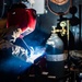 USS Carl Vinson (CVN 70) Sailor Welds in Machine Shop