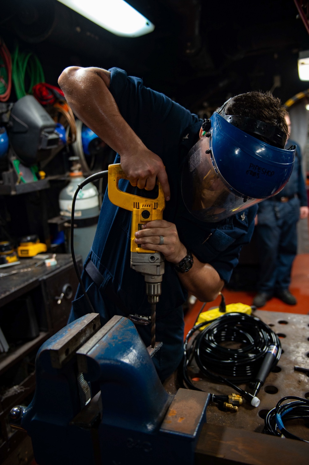 USS Carl Vinson (CVN 70) Sailor Repairs Pipe