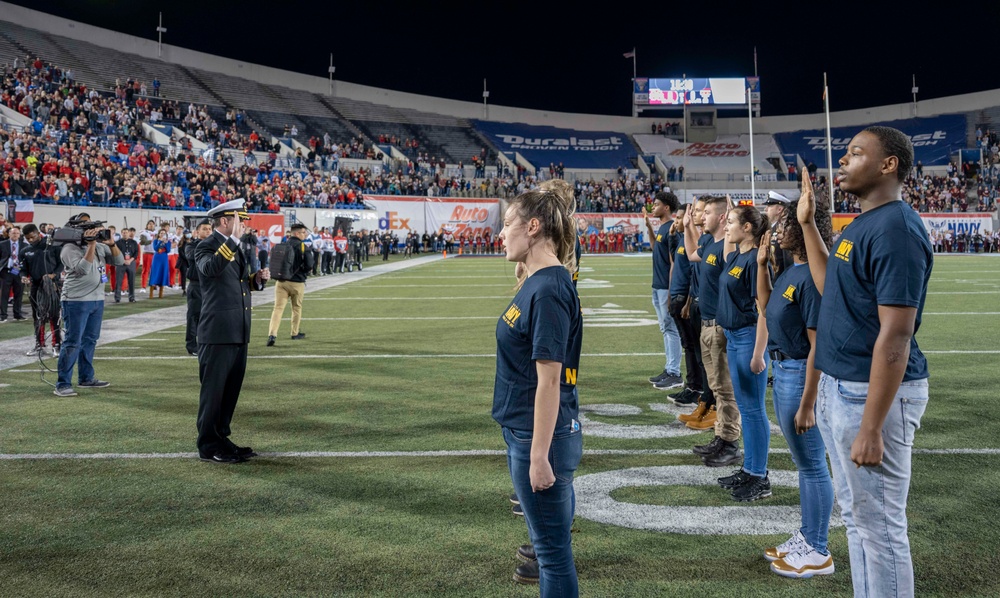 U.S. Navy Recruiters Swear in Future Sailors at Liberty Bowl