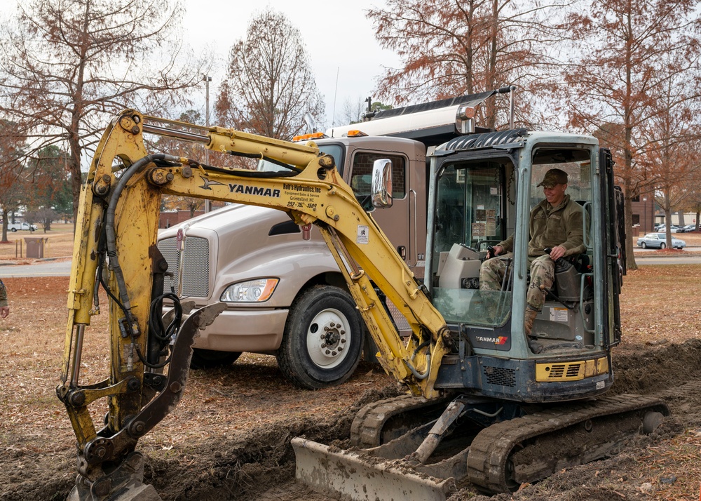 Maintenance and pavement technician construct sidewalk