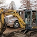 Maintenance and pavement technician construct sidewalk