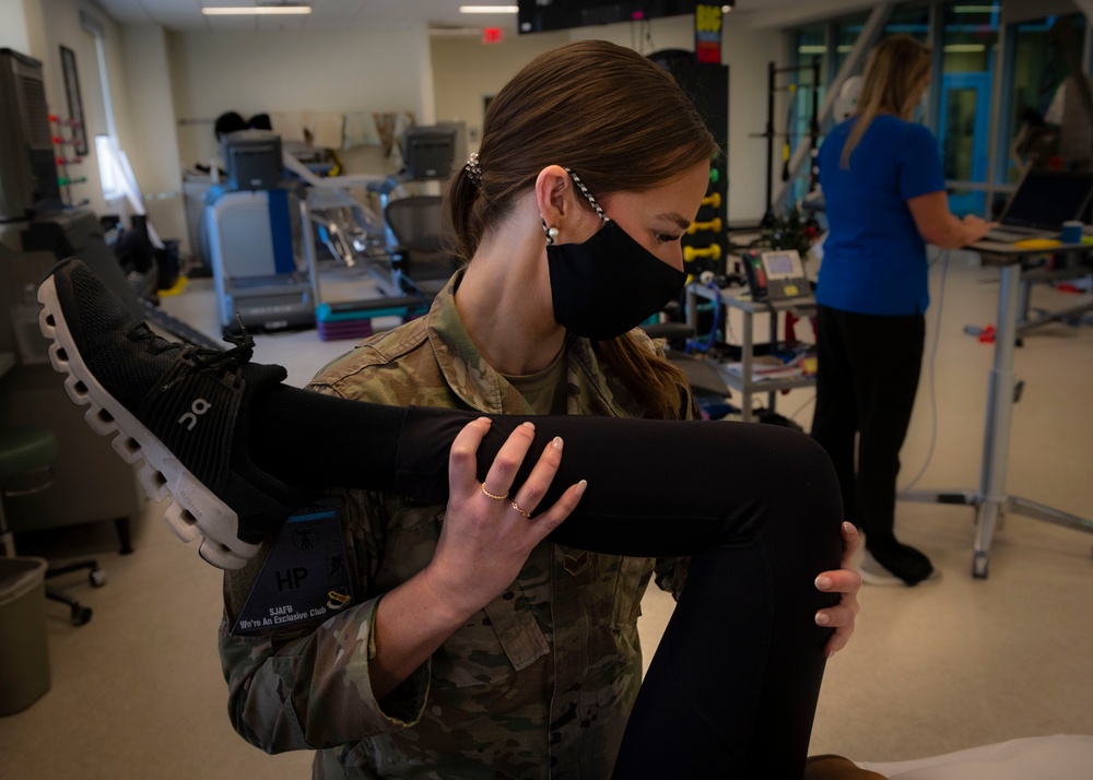 Physical Medicine Technician assists patient