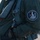 Day by Day with the 492nd Fighter Squadron The image shows a close-up of a military flight suit worn by a pilot or aircrew member. A circular patch on the left sleeve reads 'RAF Lakenheath,' 'F-15E,' and '492d Madhatters,' identifying the wearer as part of the 492nd Fighter Squadron based at RAF Lakenheath, UK. The subject is wearing full flight gear including a harness, survival vest, and associated equipment.