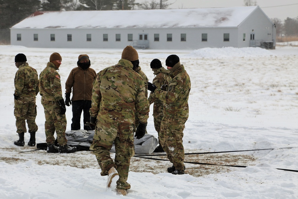 Soldiers learn to build Arctic tents during CWOC training at Fort McCoy