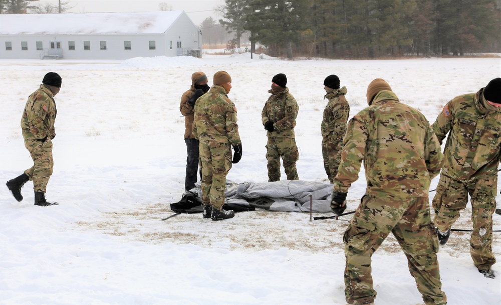 Soldiers learn to build Arctic tents during CWOC training at Fort McCoy