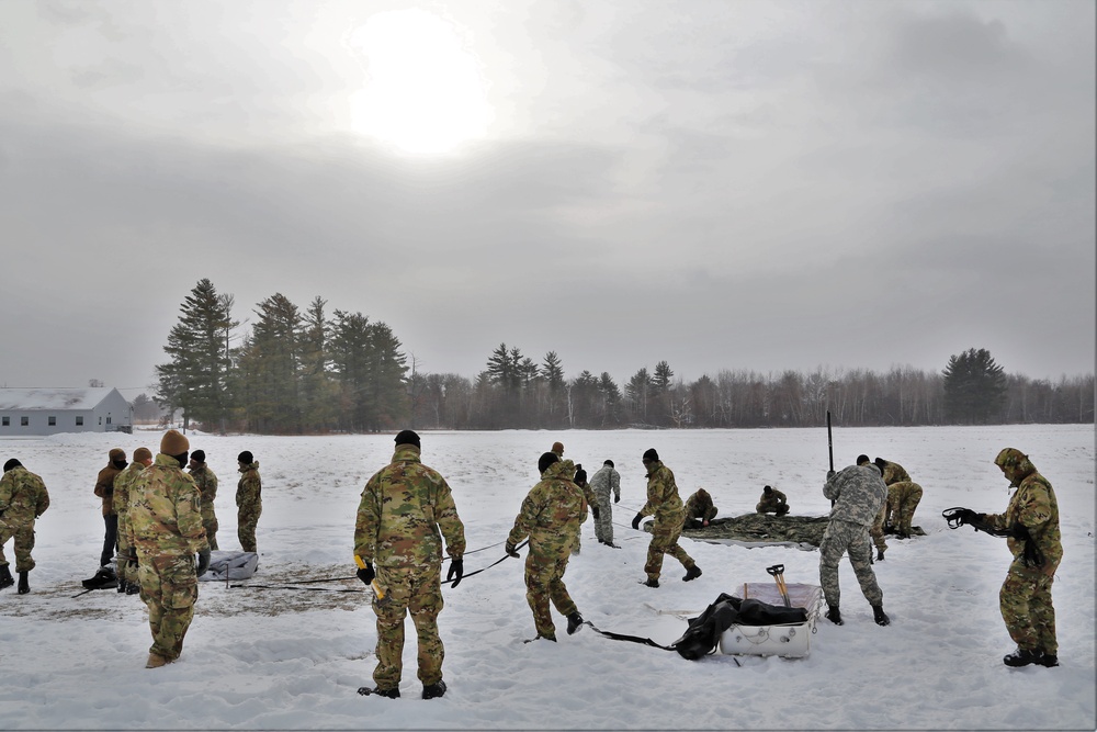 Soldiers learn to build Arctic tents during CWOC training at Fort McCoy