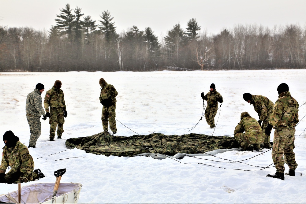 Soldiers learn to build Arctic tents during CWOC training at Fort McCoy