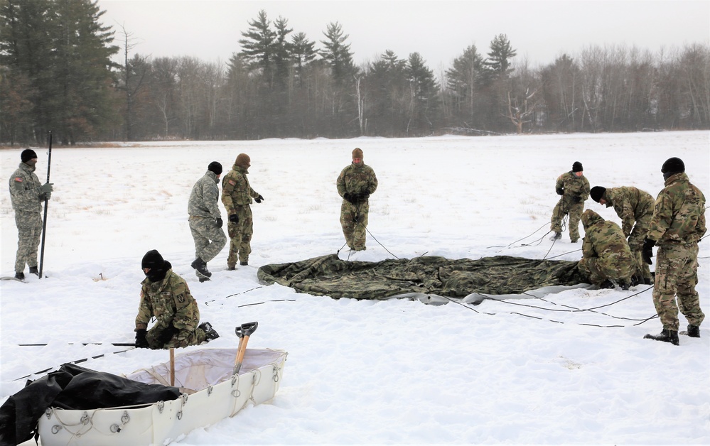 Soldiers learn to build Arctic tents during CWOC training at Fort McCoy