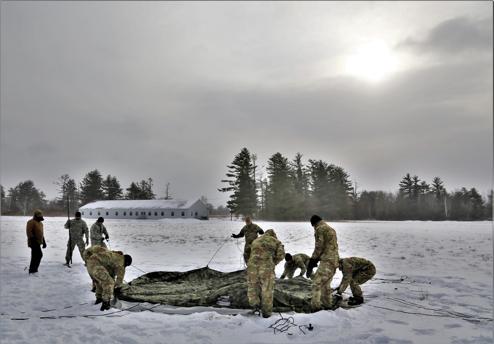 Soldiers learn to build Arctic tents during CWOC training at Fort McCoy