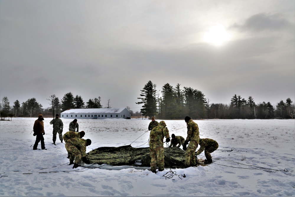 Soldiers learn to build Arctic tents during CWOC training at Fort McCoy