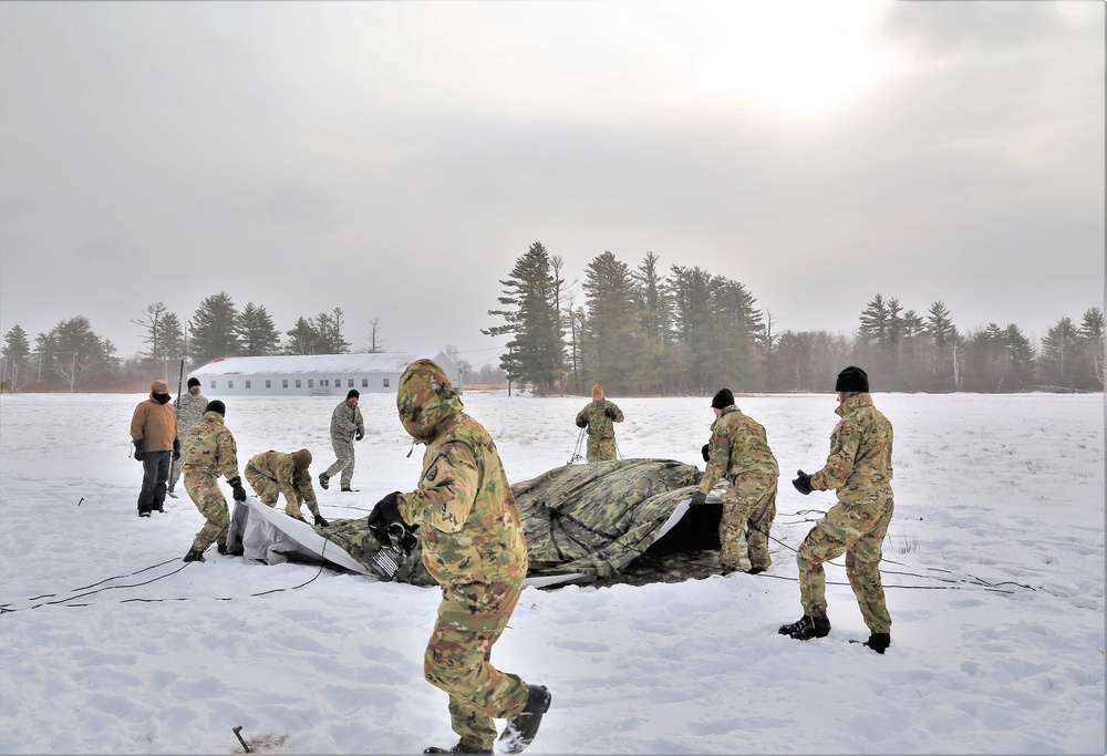 Soldiers learn to build Arctic tents during CWOC training at Fort McCoy