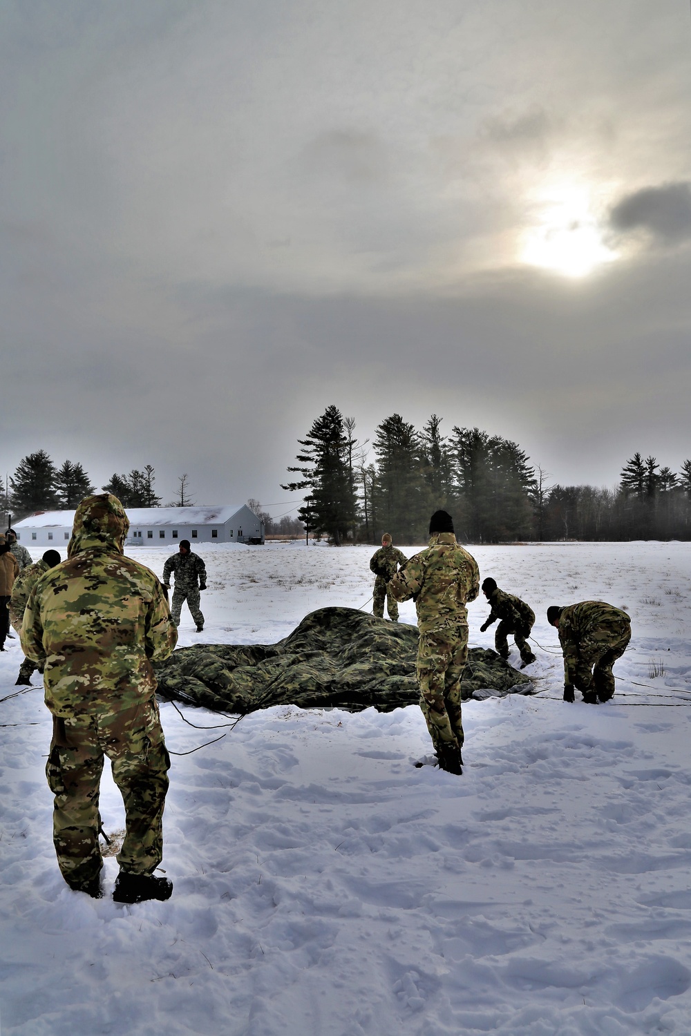 Soldiers learn to build Arctic tents during CWOC training at Fort McCoy