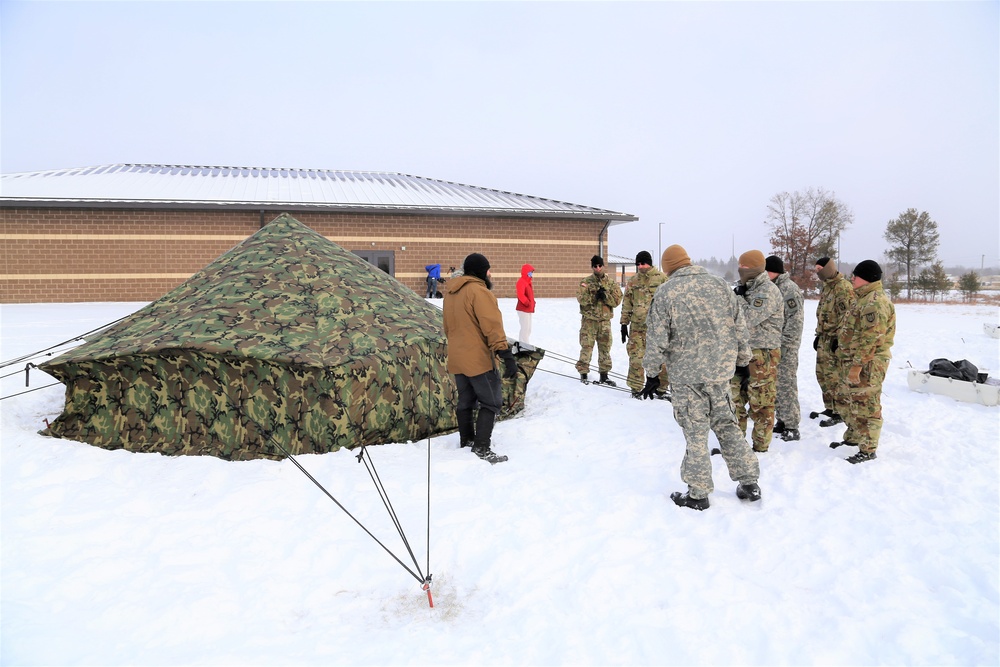 Soldiers learn to build Arctic tents during CWOC training at Fort McCoy