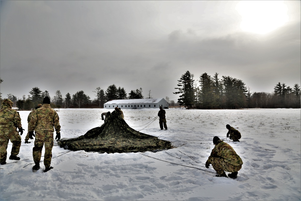 Soldiers learn to build Arctic tents during CWOC training at Fort McCoy