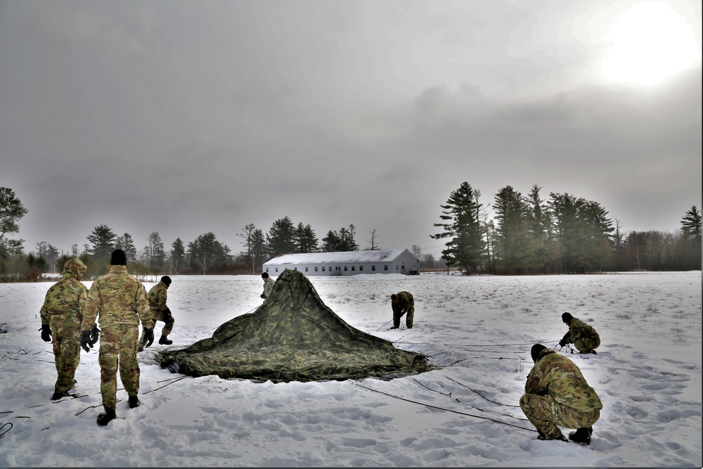 Soldiers learn to build Arctic tents during CWOC training at Fort McCoy