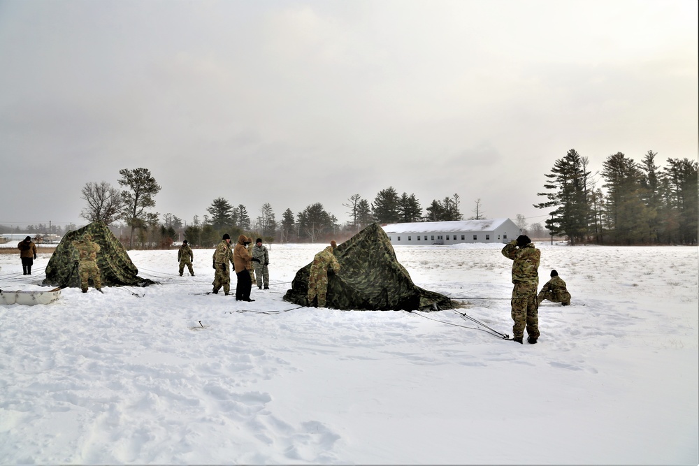 Soldiers learn to build Arctic tents during CWOC training at Fort McCoy