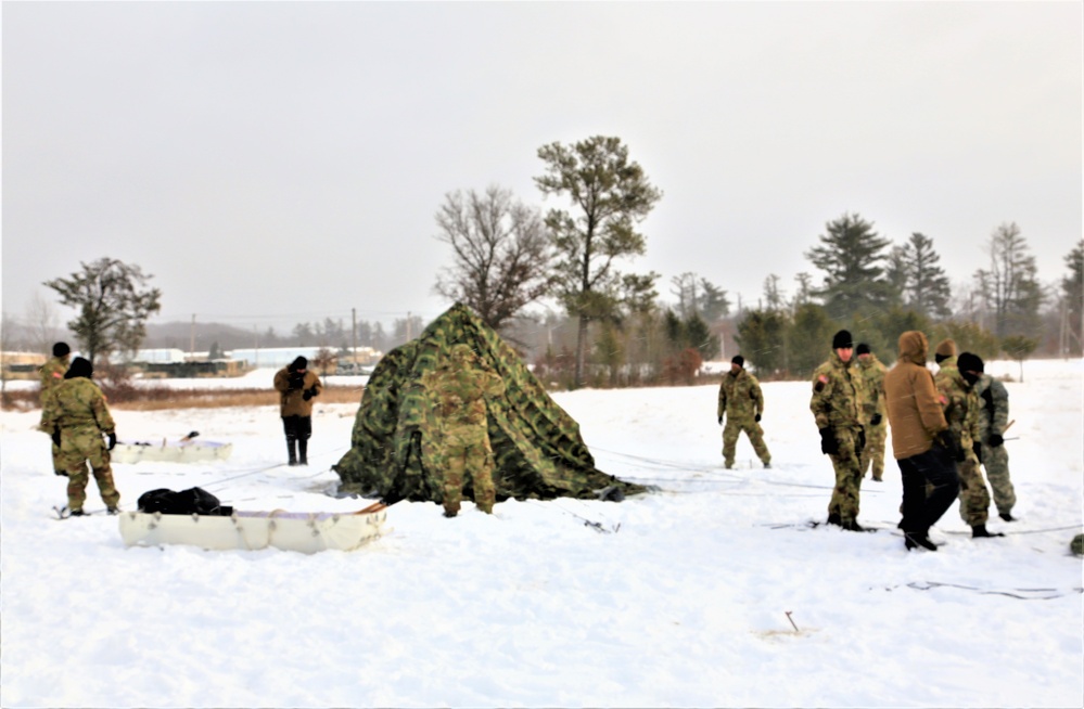 Soldiers learn to build Arctic tents during CWOC training at Fort McCoy