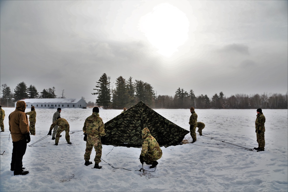 Soldiers learn to build Arctic tents during CWOC training at Fort McCoy