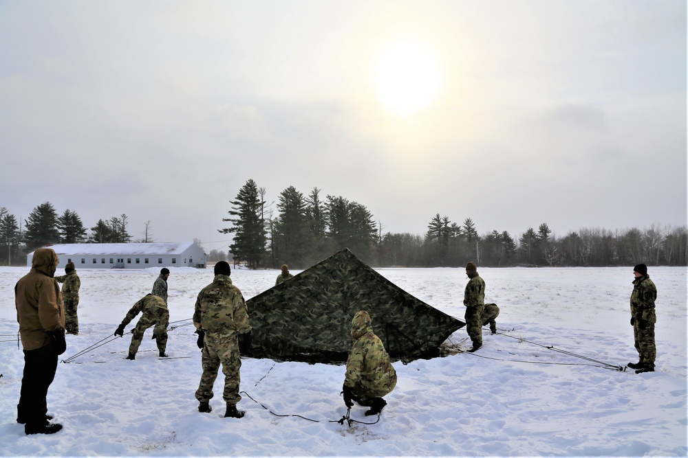 Soldiers learn to build Arctic tents during CWOC training at Fort McCoy