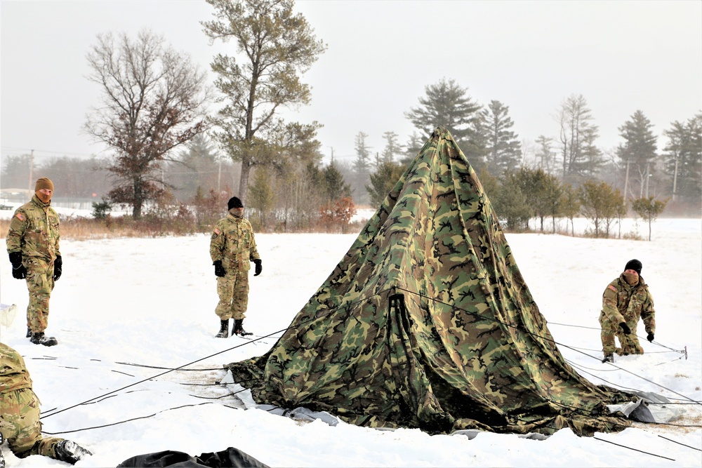 Soldiers learn to build Arctic tents during CWOC training at Fort McCoy