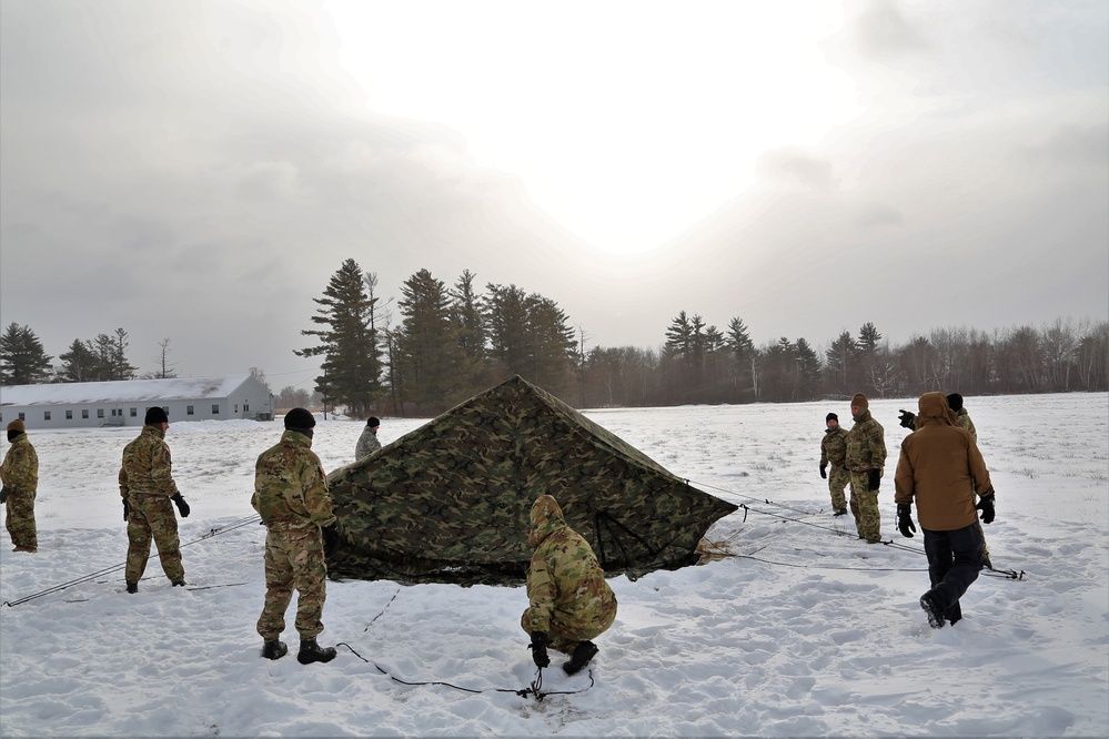 Soldiers learn to build Arctic tents during CWOC training at Fort McCoy