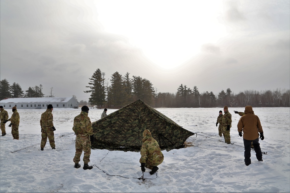 Soldiers learn to build Arctic tents during CWOC training at Fort McCoy