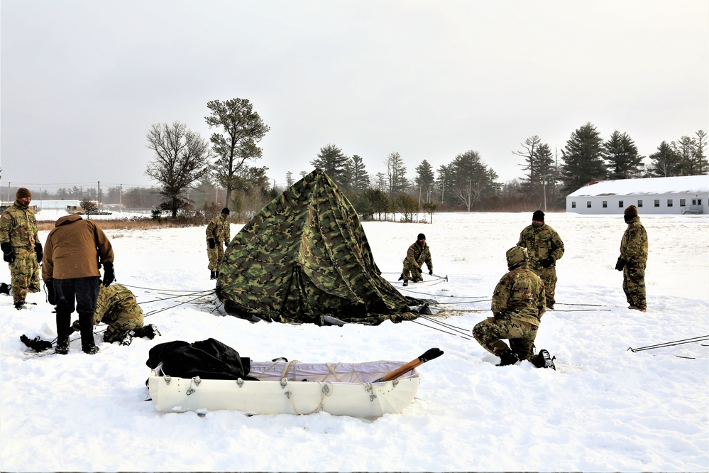 Soldiers learn to build Arctic tents during CWOC training at Fort McCoy