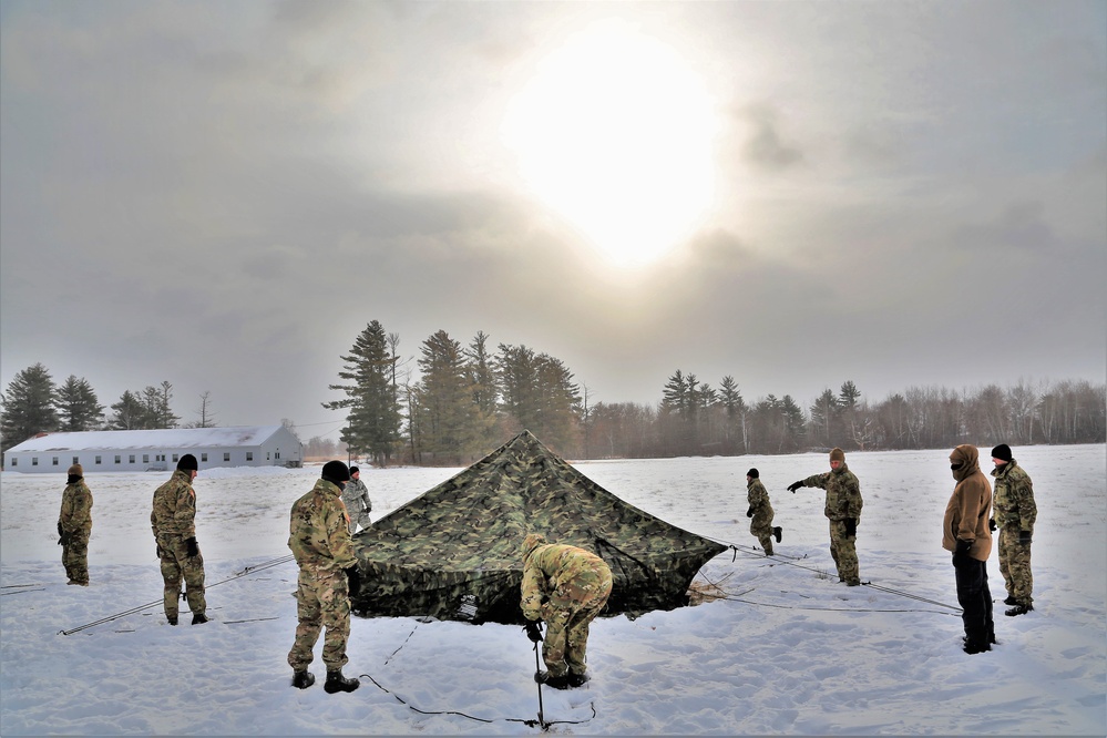 Soldiers learn to build Arctic tents during CWOC training at Fort McCoy