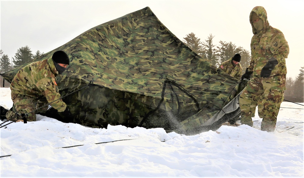 Soldiers learn to build Arctic tents during CWOC training at Fort McCoy