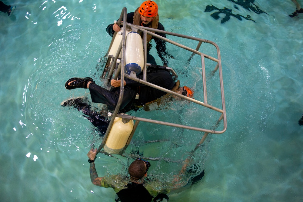 Marines with the 22nd MEU conduct Underwater Egress Training