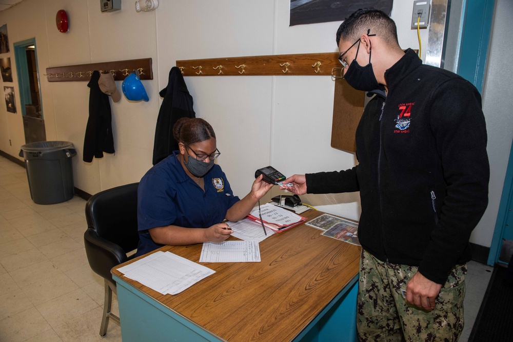 Sailors eating in the galley