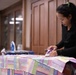 1st SFG (A) spouses with F.I.R.S.T. Mentorship Program craft quilts for displaced Afghan families