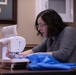 1st SFG (A) spouses with F.I.R.S.T. Mentorship Program craft quilts for displaced Afghan families