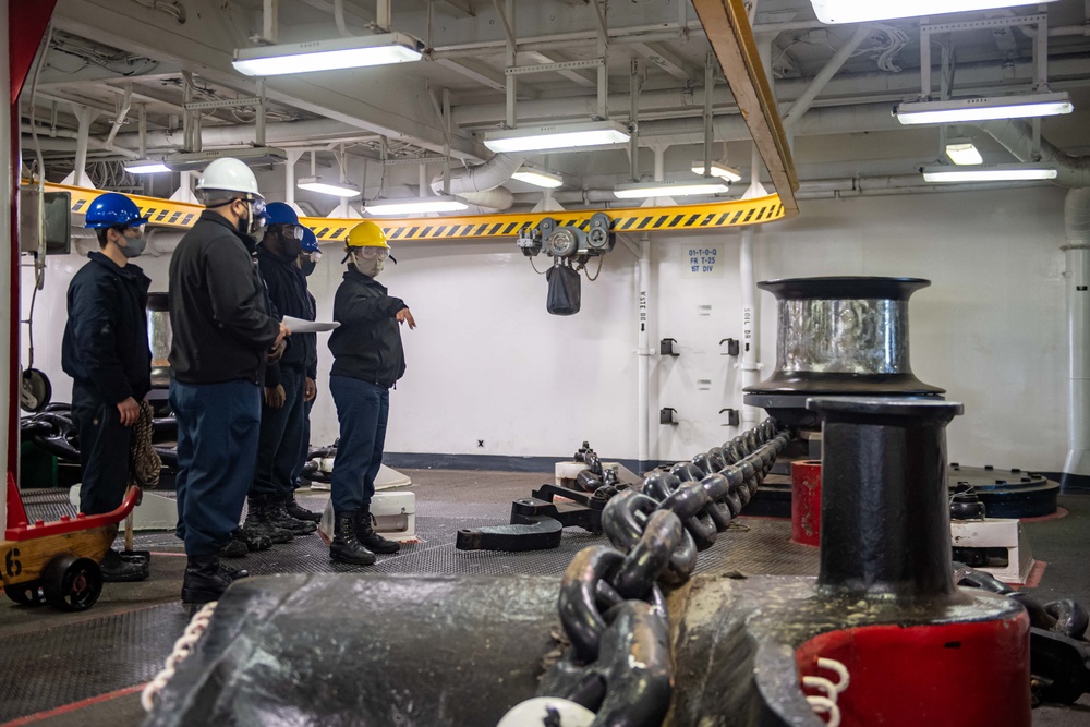 Sailors aboard the forward-deployed amphibious assault ship USS America (LHA 6) conduct an anchor drop test in the ships fo’c’sle.