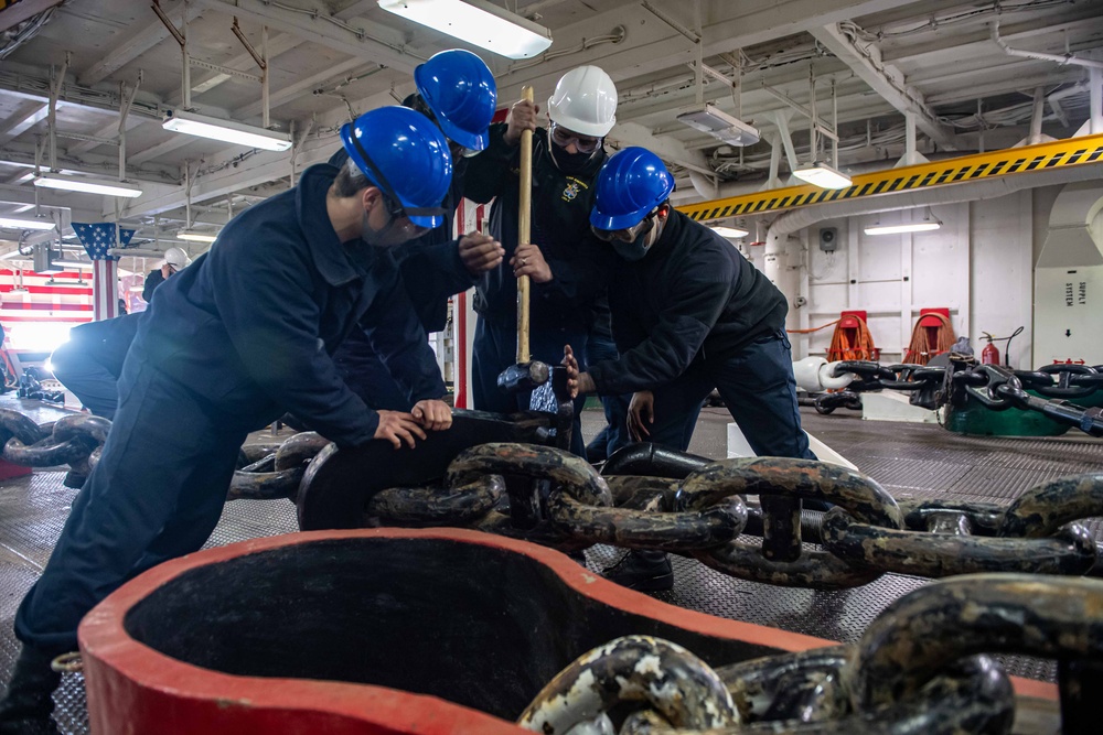 Sailors aboard the forward-deployed amphibious assault ship USS America (LHA 6) conduct an anchor drop test in the ships fo’c’sle.