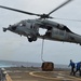 USS Lake Champlain conducts vertical replenishment-at-sea in the South China Sea