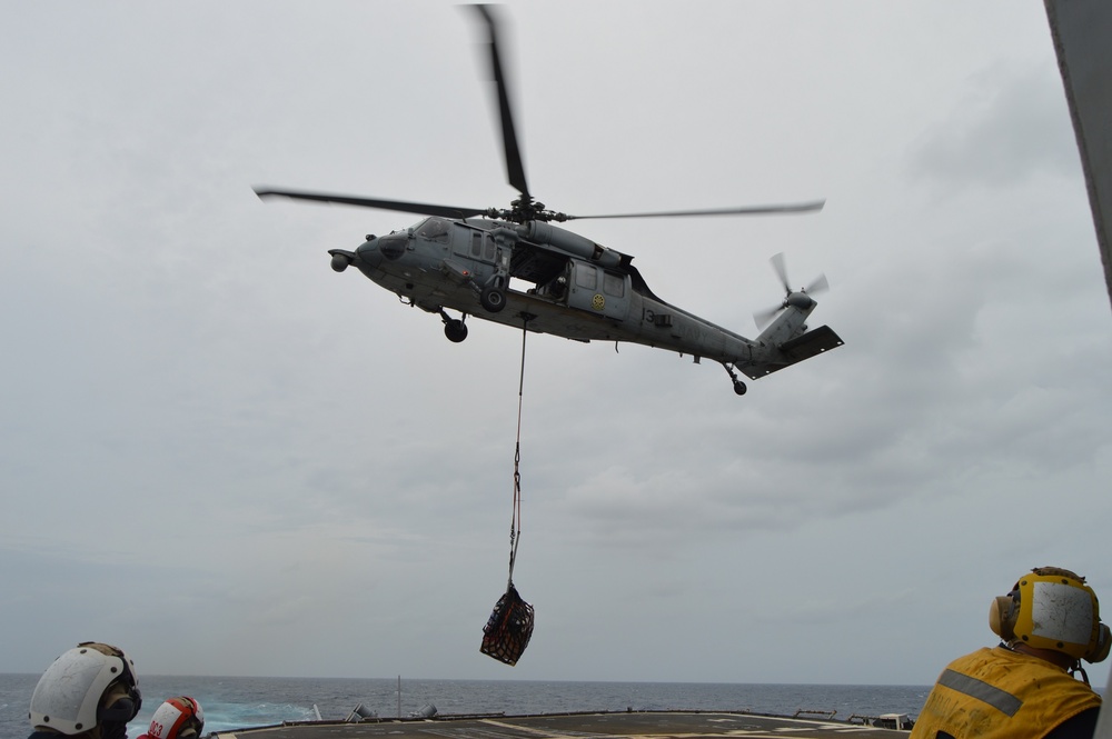 USS Lake Champlain conducts vertical replenishment-at-sea in the South China Sea