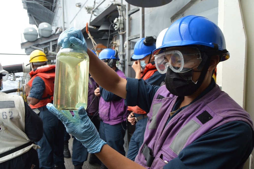 USS Lake Champlain conducts replenishment-at-sea in the South China Sea